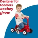 Toddler enjoying the Radio Flyer Scoot 2 Scooter in ride-on mode