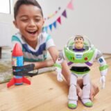 Child playing with Buzz Lightyear figure and detachable rocket toy