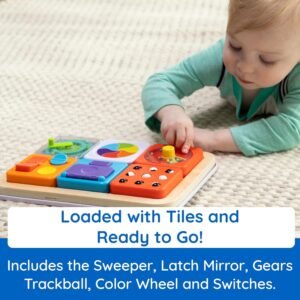 Toddler Playing with Magnetic Tiles on Fat Brain Toys Sensory Busy Board