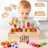 Toddler matching wooden beads to pattern cards on a stacking stand