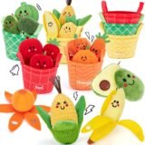 An assortment of cute plush fruit and vegetable toys with happy smiling faces, stored in four color-coded fabric buckets labeled Red, Orange, Yellow, and Green.