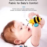 Close-up of a baby wearing a soft bee wrist rattle, highlighting the premium cotton-rich stretchy fabric designed for comfort and skin safety.