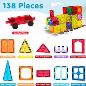 Toddler building a tall castle using 3D magnetic construction blocks