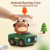 Close up of a hand pressing the head of the animal toy car to activate movement