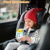 A child playing with a compact pocket speech toy while sitting in a car seat, demonstrating the portable design for learning and entertainment during travel.